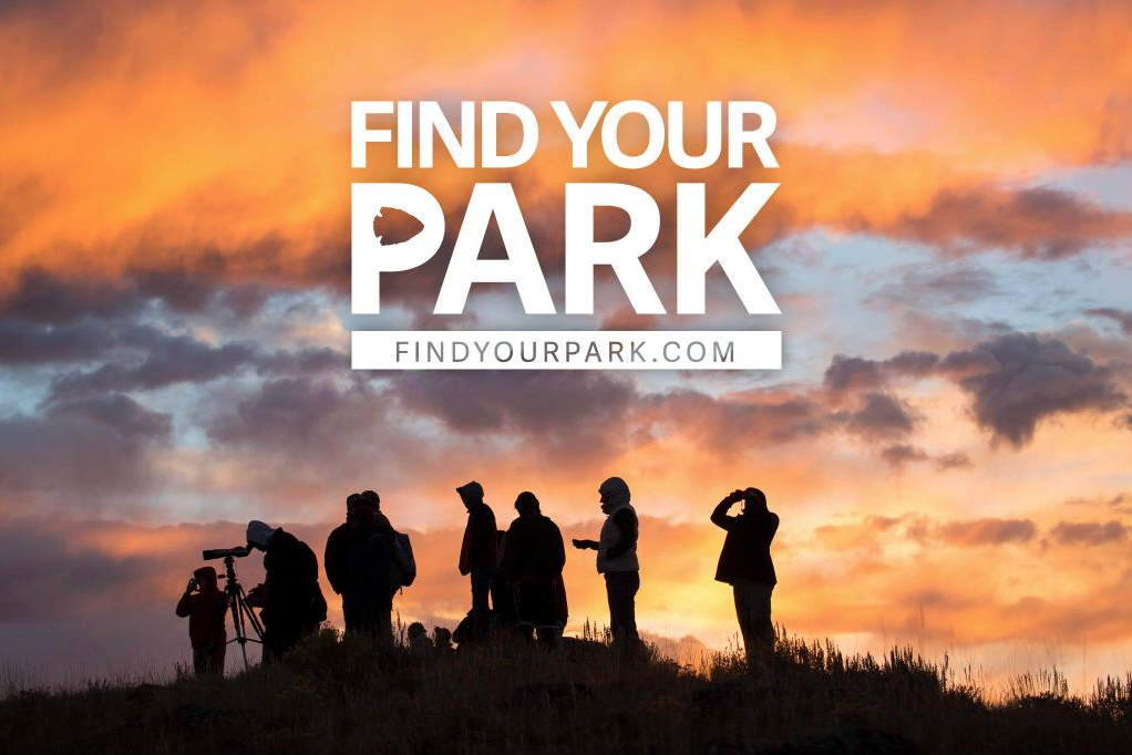 "Find your Park" text overlaid on a photo of a sunrise with silhouettes of people. 