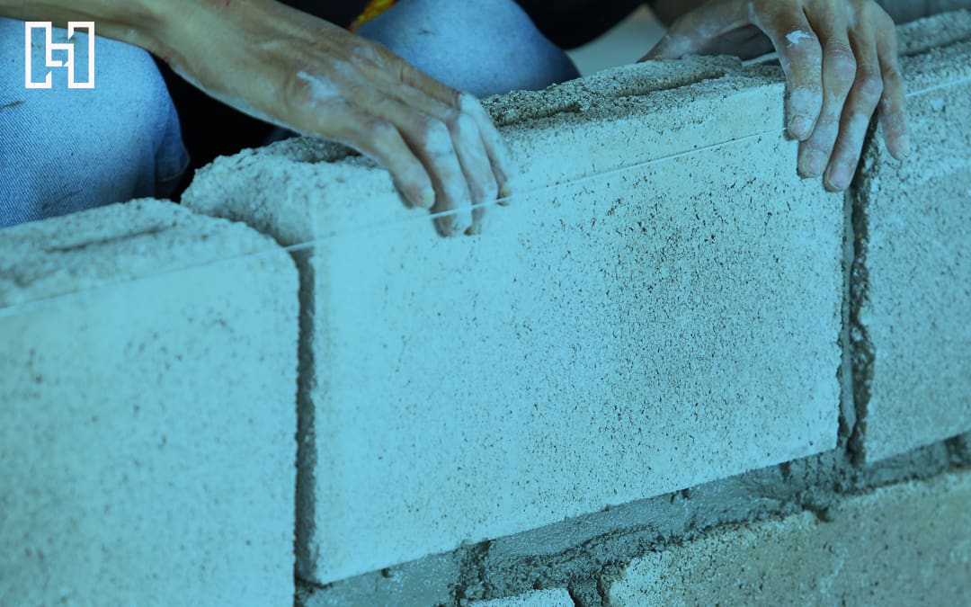 Featured image of hands building brick wall