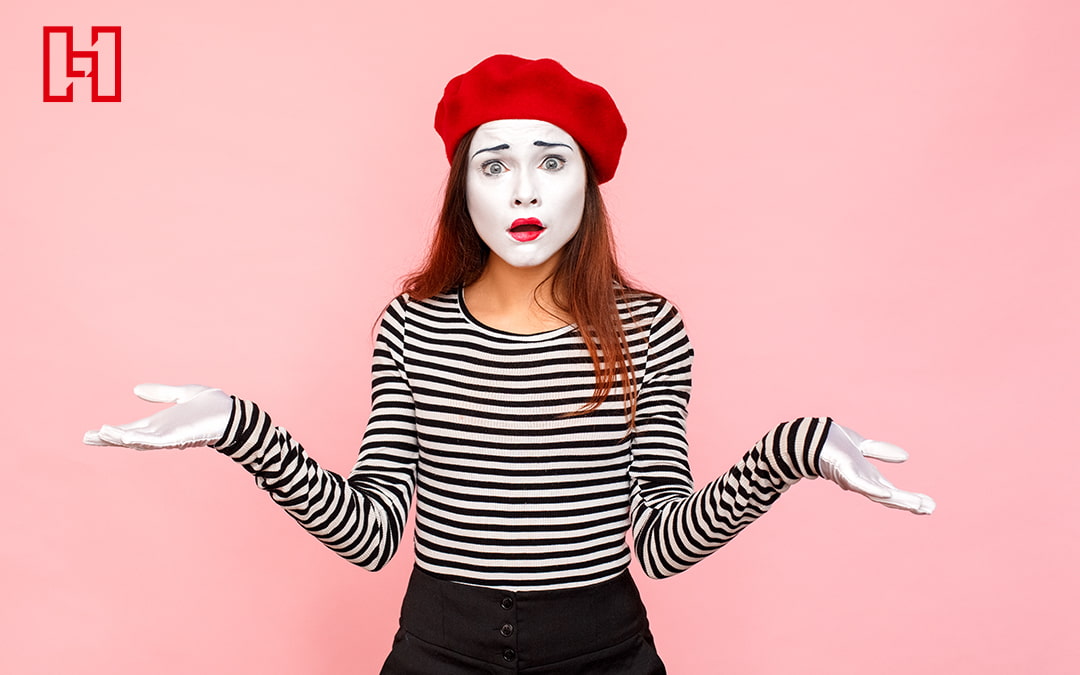 Woman Dressed as a Mime Shrugging