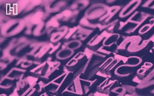 Close-up of letter stamps in one sheet in purple