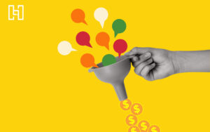 Hand holding a funnel with speech bubbles going in and coins coming out to represent best CRM alternatives to HubSpot
